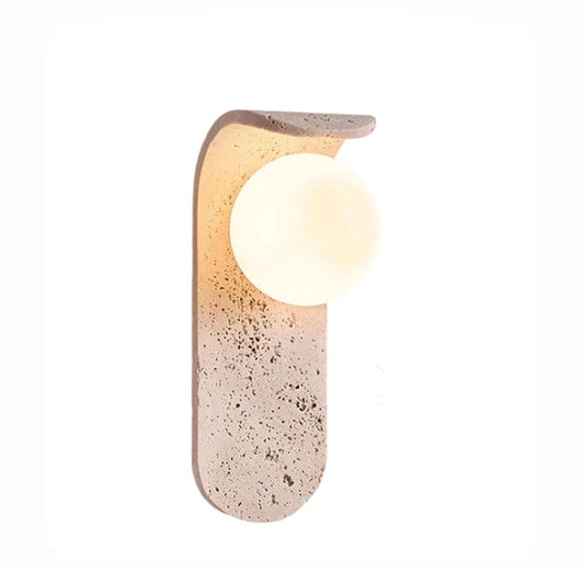 Irregularly shaped yellow travertine wall lamp