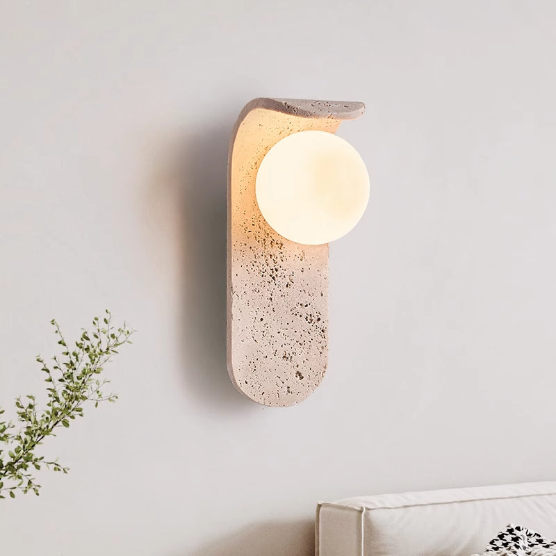 Irregularly shaped yellow travertine wall lamp