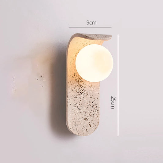 Irregularly shaped yellow travertine wall lamp