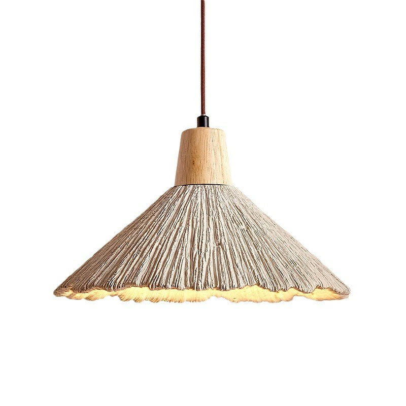 Umbrella-shaped cement penndant lamps are used in restaurant kitchens, etc.