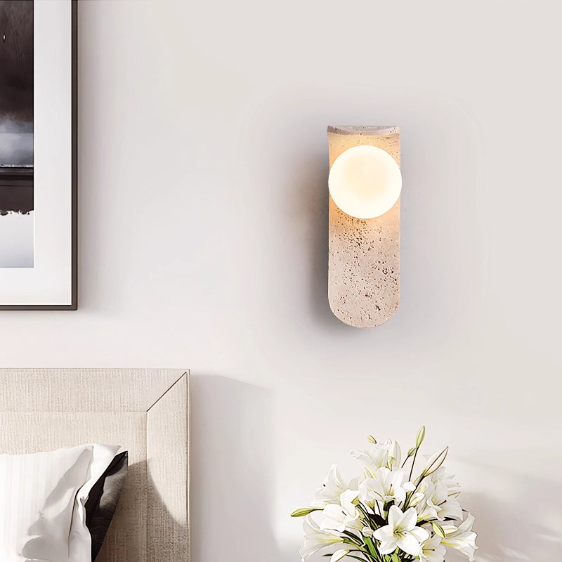 Irregularly shaped yellow travertine wall lamp