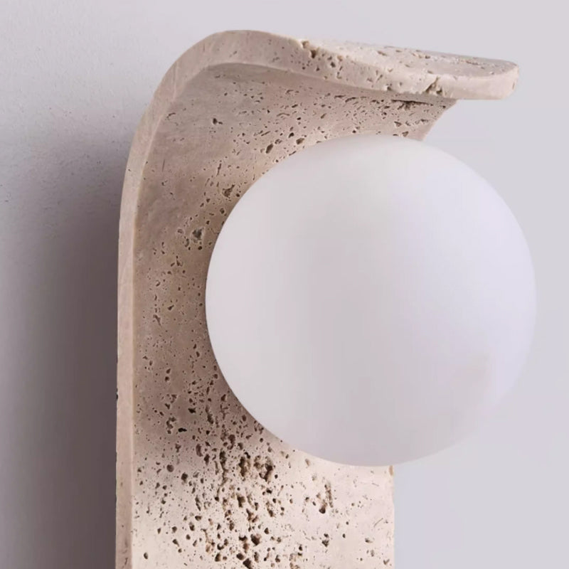Irregularly shaped yellow travertine wall lamp