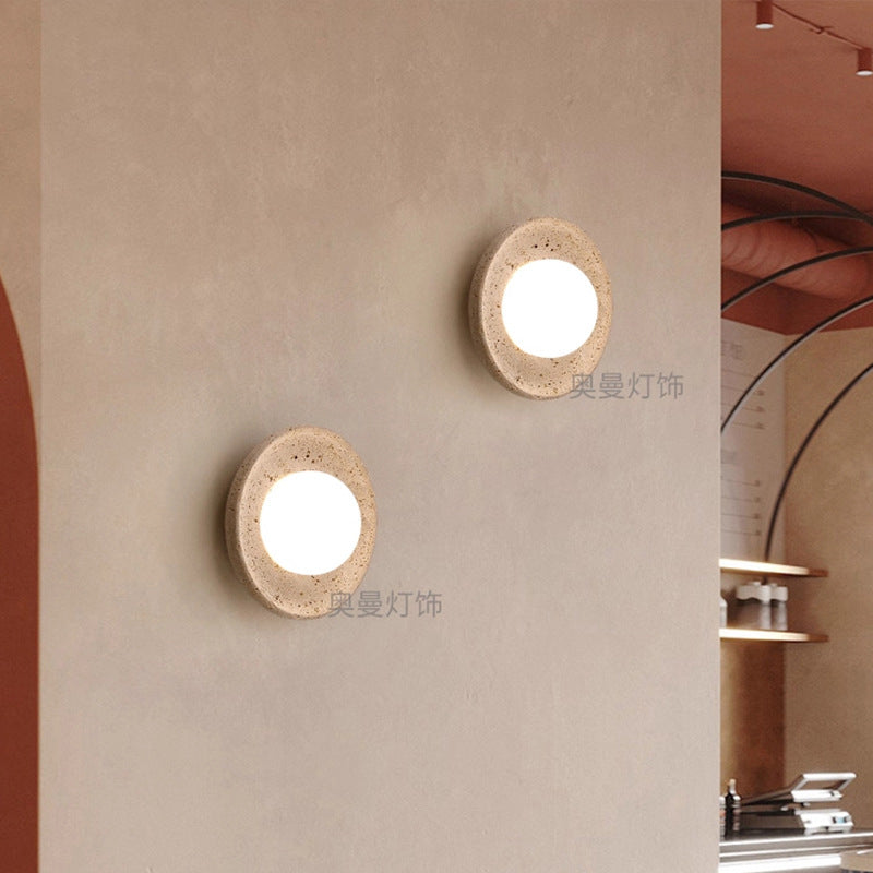 Yellow travertine wall lamps are used in bedrooms, living rooms, and clothing stores.