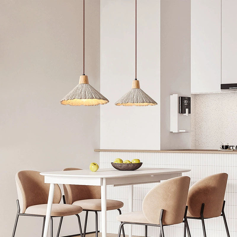 Umbrella-shaped cement penndant lamps are used in restaurant kitchens, etc.