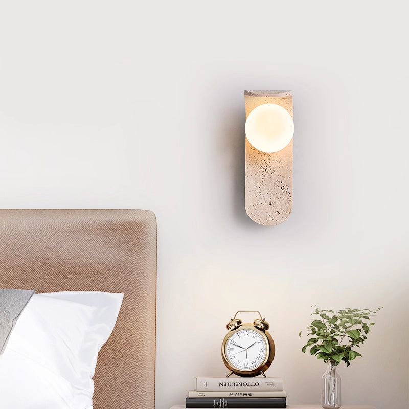 Irregularly shaped yellow travertine wall lamp